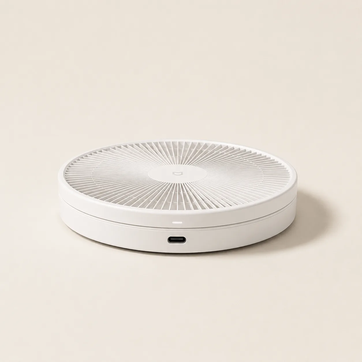 Le ventilateur entièrement replié, vu de dessus, réduit à son socle circulaire
